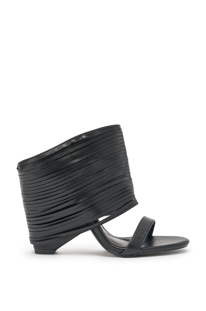 The AZALEA WANG DREIA BLACK PU FRINGE WEDGE SANDAL features a wide, layered ankle cuff with fringe, a thin toe strap, low angled wedge heel, comfort cushion insole, and modern sculptural design. 3