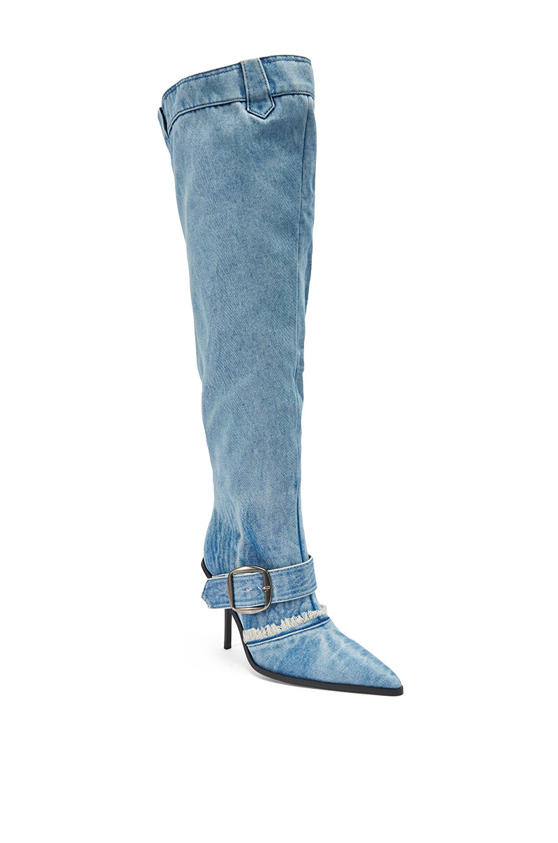 The AKIRA GOLD DURANGO DENIM STILETTO PANT LOOK BOOT is a knee-high, light blue denim boot with a pointed toe, large cuff, and an ankle strap featuring a metal buckle detail. 5
