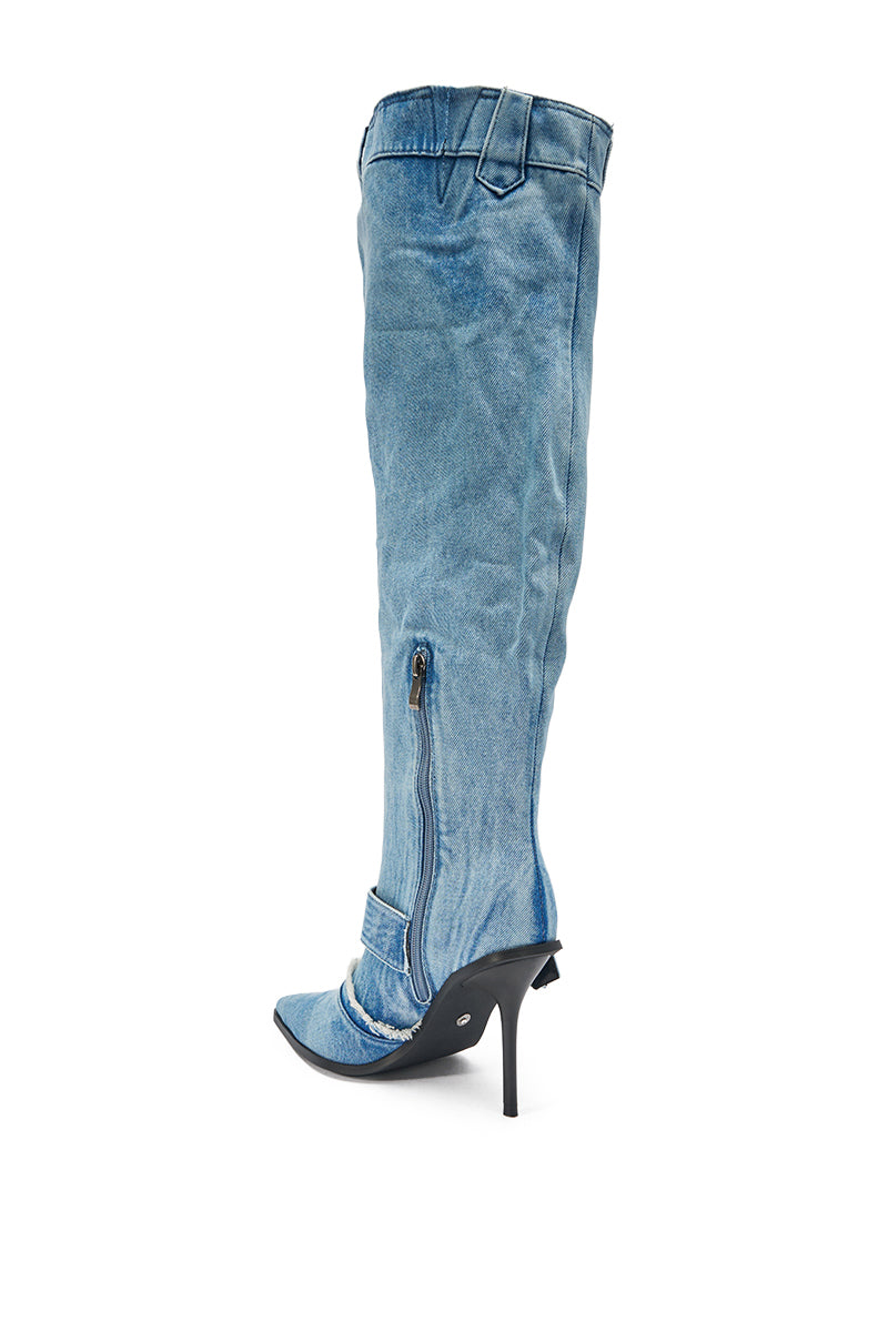 The AKIRA GOLD DURANGO DENIM STILETTO PANT LOOK BOOT is a knee-high, pointed-toe denim boot with a visible side zipper and stiletto heel, shown against a white background. 6