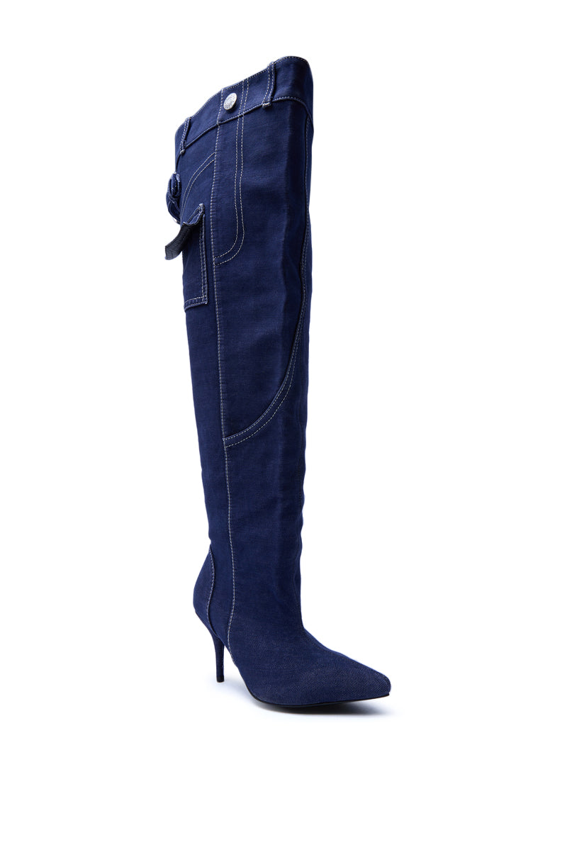 The AZALEA WANG DUSTAN DENIM THIGH STILETTO BOOT features a dark wash, pointed toe, stiletto heel, contrast stitching, plus a decorative strap and button at the top.
