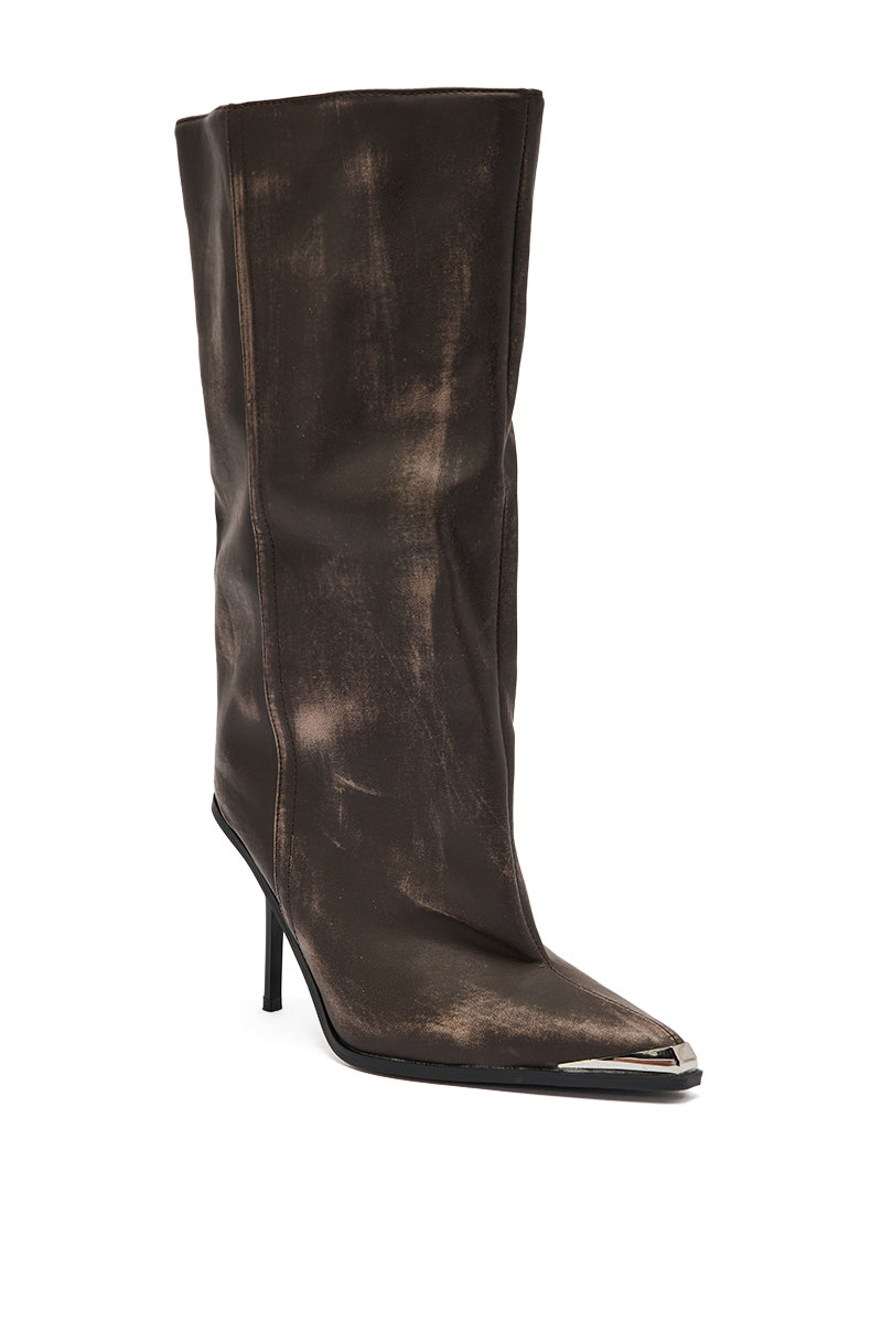 The AZALEA WANG DUSTY BROWN WEATHERED PU BOOT is a tall, slouched faux leather boot with a distressed finish, pointed metal-tipped toe, high stiletto heel, and creased shaft for a chic, worn-in style.