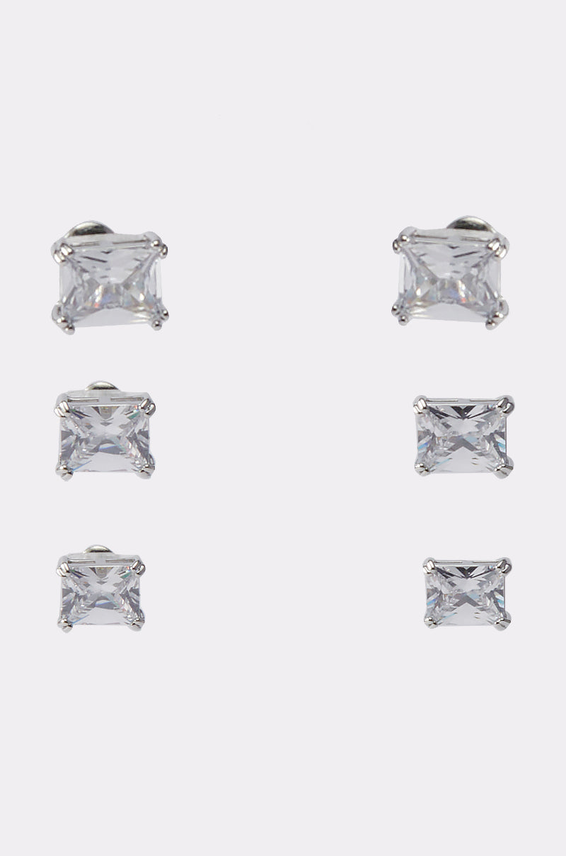 Three pairs of rectangular clear cubic zirconia stud earrings in silver-tone prong settings, displayed in two columns on a plain white background. Product: 3 PACK STUD EARRING. 0