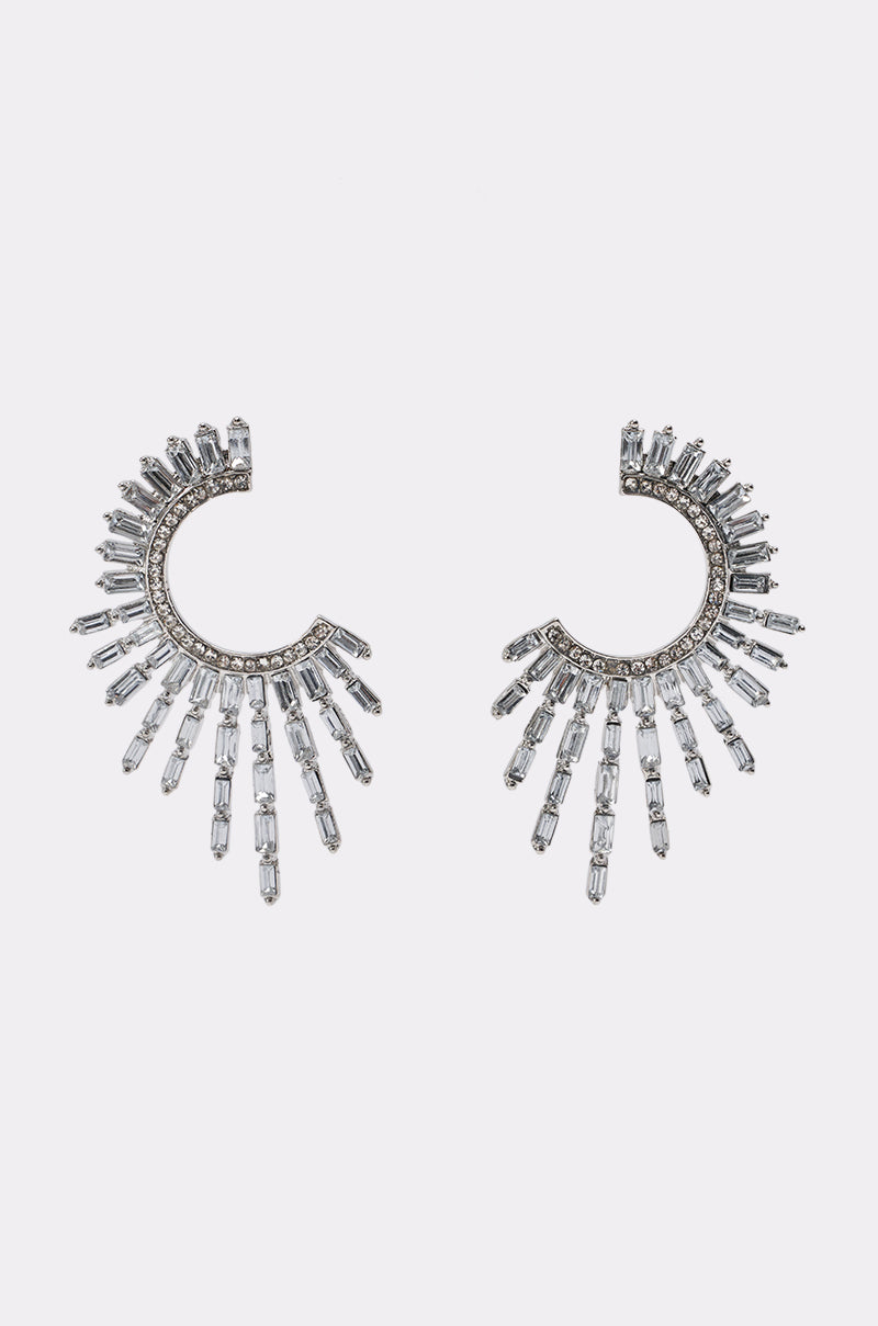 Introducing the CRYSTAL BURST EARRINGS—a pair of silver, fan-shaped earrings featuring clear rectangular crystals arranged in a dazzling sunburst pattern. Perfect for adding an elegant, formal touch to any occasion.