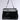 The ROXANNE FAUX LEATHER SATCHEL is a sleek black bag with a structured design and short handle. Its flap closure, featuring a silver rectangular buckle, contrasts elegantly against the light grey backdrop, while its textured faux leather enhances sophistication.