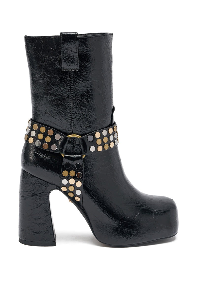 The AZALEA WANG MID CALF PU LEATHER CHUNKY BOOTIE is a black faux leather boot with a platform sole, chunky heel, and an ankle strap adorned with metallic studs.