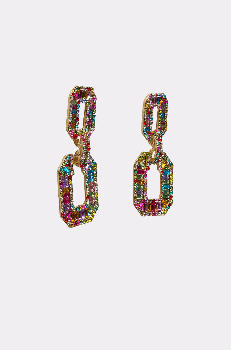 The TASTES LIKE CANDY EARRING features gold-toned statement drops with two geometric links, each adorned with multicolored rhinestones, making them pop against a plain light background. 2