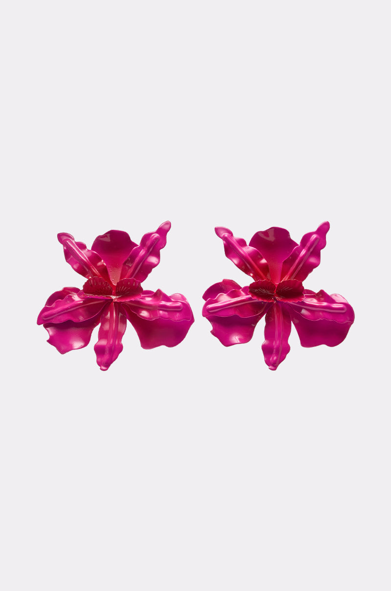 The REALLY HER EARRING features two oversized fuchsia floral statement earrings with layered petals, displayed side by side on a light background—perfect for bold, pink flower-inspired looks. 0