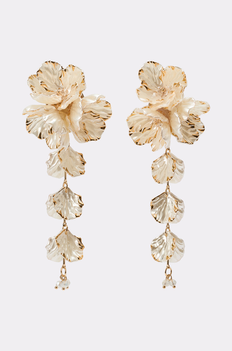 The KATYA EARRING features gold-toned floral drops with detailed flowers on top, cascading leaf-shaped charms, and small bead accents—an elegant choice for weddings.