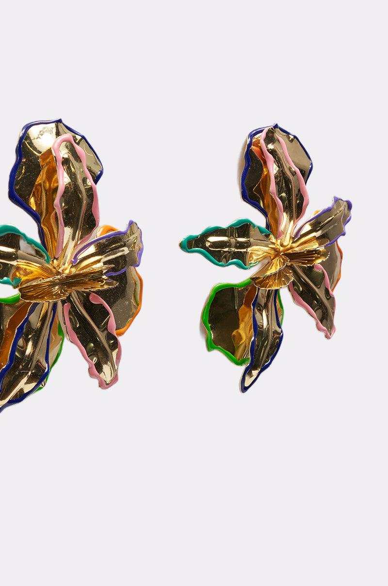 The FLY ME OUT EARRING features two large, metallic multicolor floral earrings with gold, pink, green, and blue accents on each petal—a perfect statement piece for any bold look. Displayed on a plain light background. 5