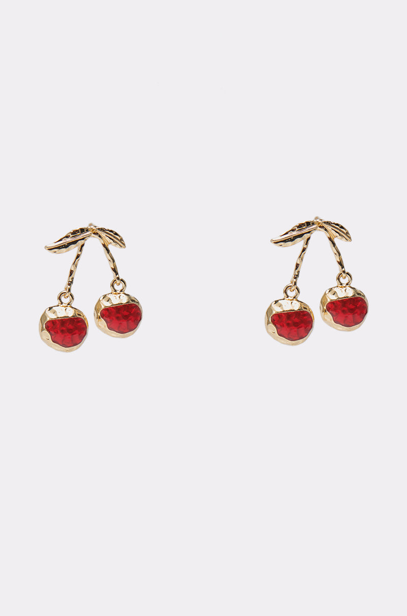 The POP MINE EARRING features gold-tone cherry earrings with two red cherry charms and gold leaves on each, shown against a plain white background. 0