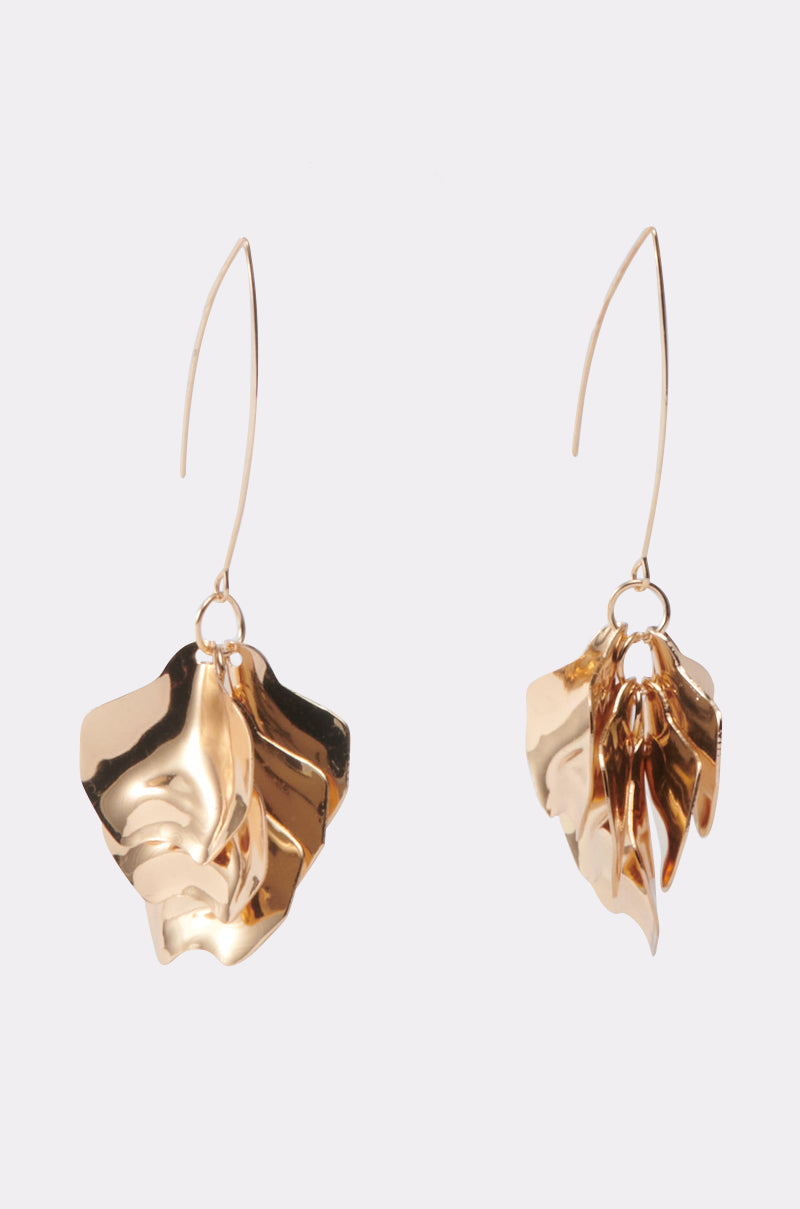 A pair of METALLIC MANIA EARRINGS featuring a gold, crinkled texture with wavy, abstract shapes dangle from thin curved hooks, set against a light gray background. 2