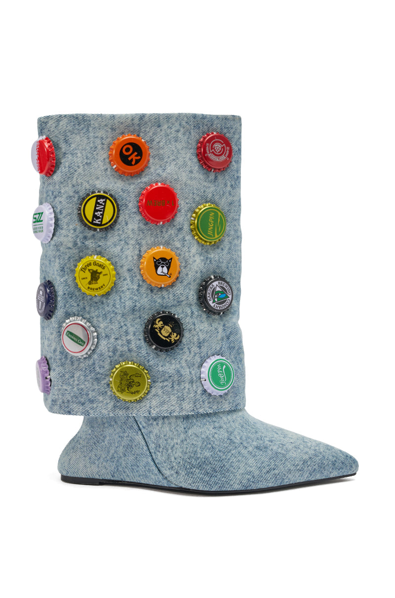 The AZALEA WANG EAVEN WEDGE EMBELLISHED DENIM BOOTIE features a denim-textured mid-calf shaft decorated with colorful bottle caps for a playful vibe, showcased against a white background.