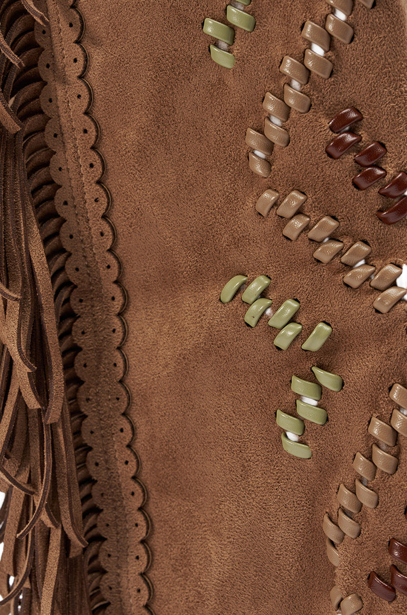 Close-up of AZALEA WANG EDMUND BROWN FLAT WESTERN BOOT featuring brown faux suede, scalloped edge, Western-inspired fringe, and interwoven green, tan, and dark brown strips for a richly textured design. 8