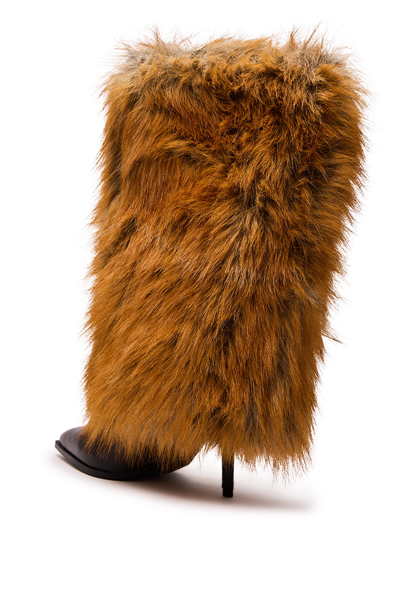 The AZALEA WANG EKKEN RED FOX FUR STILETTO BOOT is a mid-calf, high-heeled boot with thick, shaggy reddish-brown faux fur, a pointed black toe, and a slim stiletto heel.