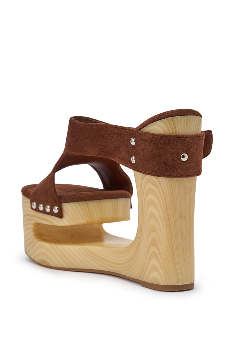 The AZALEA WANG ELGEDI TAN PLATFORM SANDAL features brown suede, a thick sculpted light wood platform and wedge heel, silver rivet accents, and chic cut-out details for a stylish boho vibe. 8