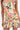 A person wearing the Flounce Corset Mini Dress, featuring a colorful floral strapless neckline, lace-up sides, and a pleated skirt, stands against a plain white background.