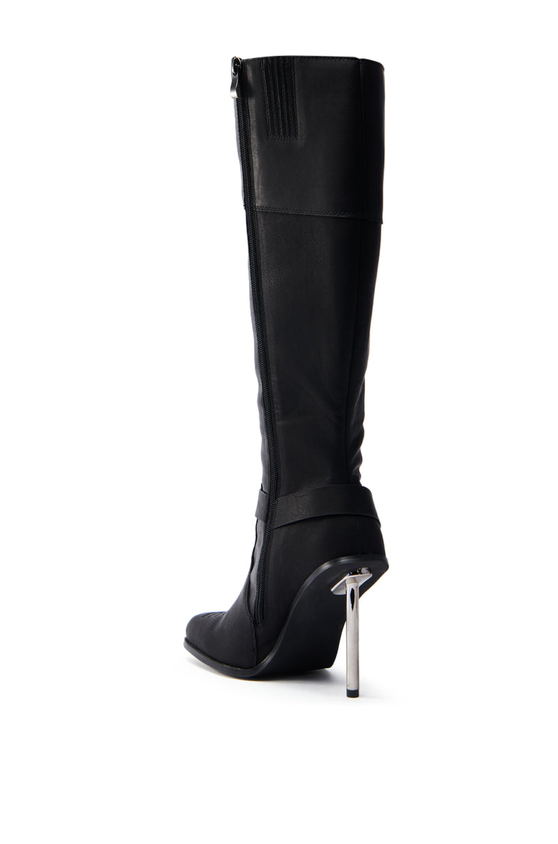 The ELLERY BLACK STILETTO BOOT showcases a sleek design with a faux leather upper and pointed toe. Its knee-high shaft and unique shiny metal high heel are elegantly displayed in profile against a plain white background.