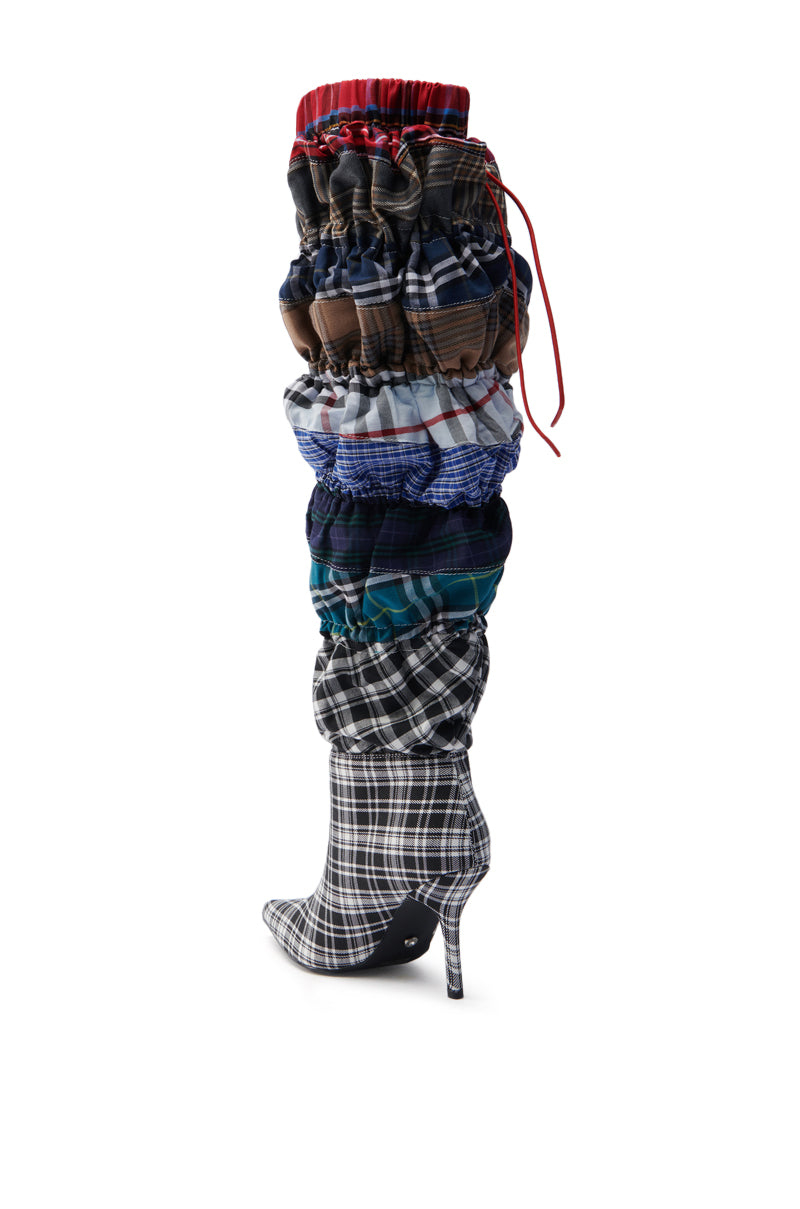 The AZALEA WANG ELODIE MULTI BOXER BOOT is a knee-high, slouchy design with vibrant plaid patterns, featuring a slender stiletto heel and cascading scrunched layers.