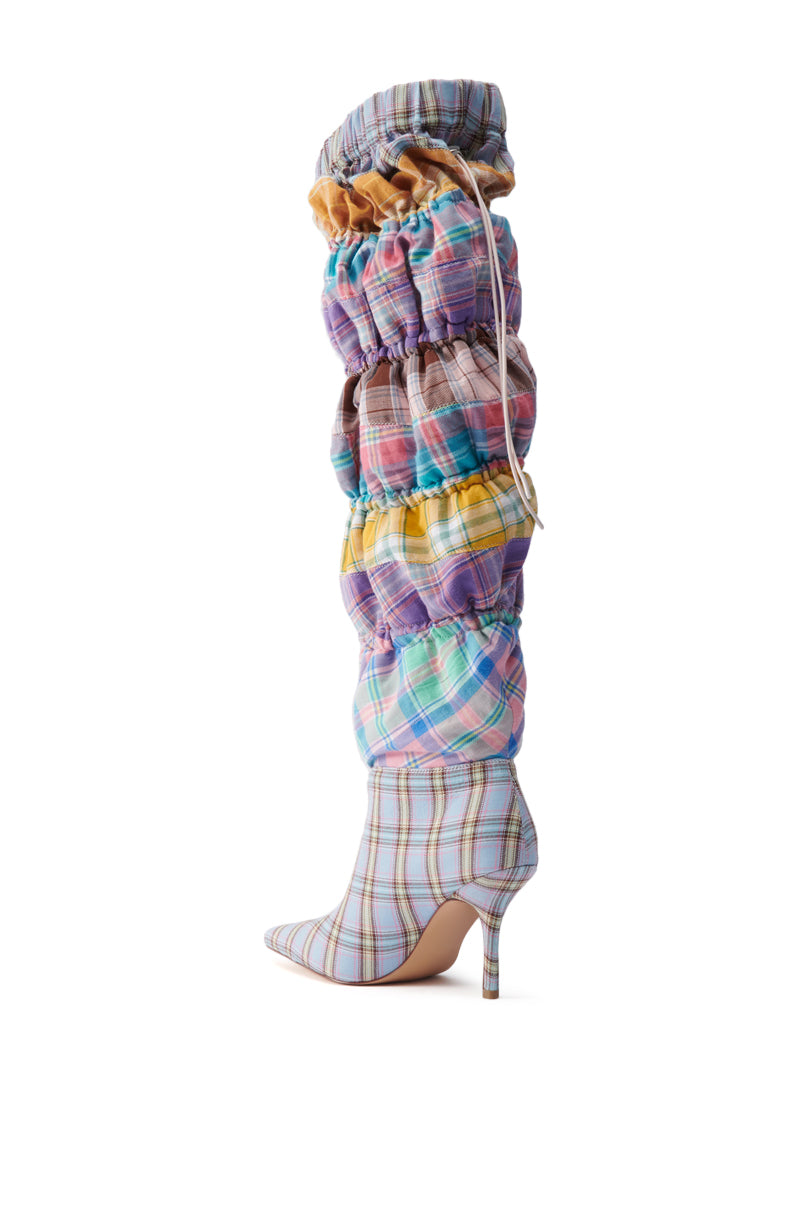 The AZALEA WANG ELODIE PINK MULTI BOXER BOOT is a knee-high stiletto with a pointed toe, featuring ruched pastel plaid panels in purple, blue, yellow, and pink for a bold statement look.