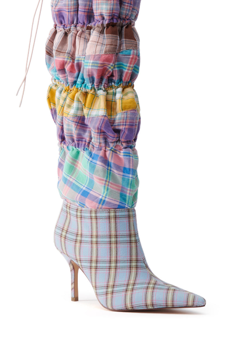 The AZALEA WANG ELODIE PINK MULTI BOXER BOOT is a pointed-toe, knee-high stiletto with scrunched ruched pastel plaid detailing along the calf.
