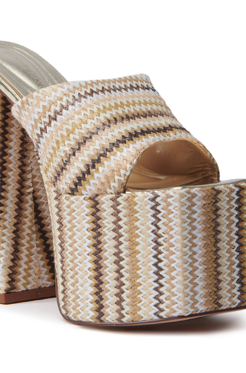The AZALEA WANG EMBERS BROWN CHUNKY PLATFORM SANDAL features a multicolored zigzag design in beige, brown, and white. It includes an open square toe and a thick heel.