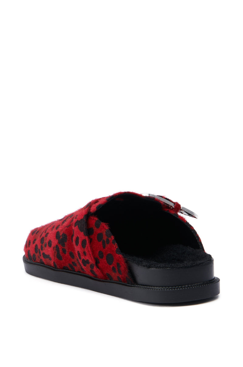 The AZALEA WANG ENDGAME RED LEOPARD slipper boasts a bold red leopard print, highlighted by an open toe design and complemented by a black sole. Constructed with a plush texture of faux pony hair, it is adorned with an elegant buckle detail on the side. The slipper is presented beautifully on a white background.