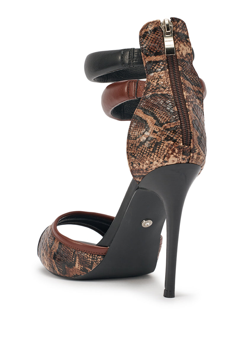 The AZALEA WANG EREMIEL Black Mixed Material Stiletto Sandal features a snake print, cushioned ankle rings, comfort insole, black stiletto heel, and a back zipper. Shown highlighting its fashionable side and back views. 6
