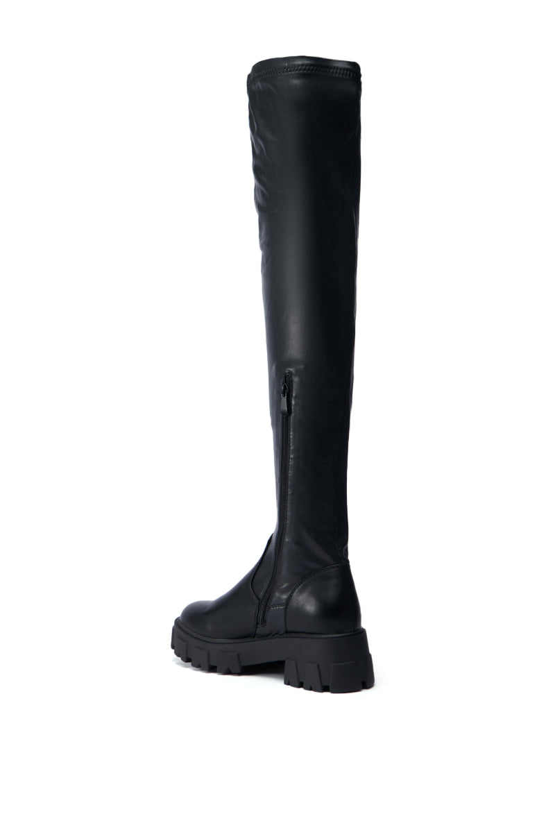 Introducing the AZALEA WANG EUREVA BLACK FLAT BOOT, a sleek knee-high boot crafted from faux leather, featuring a thick sole, chunky heel, and convenient side zipper for a stylish yet rugged look.