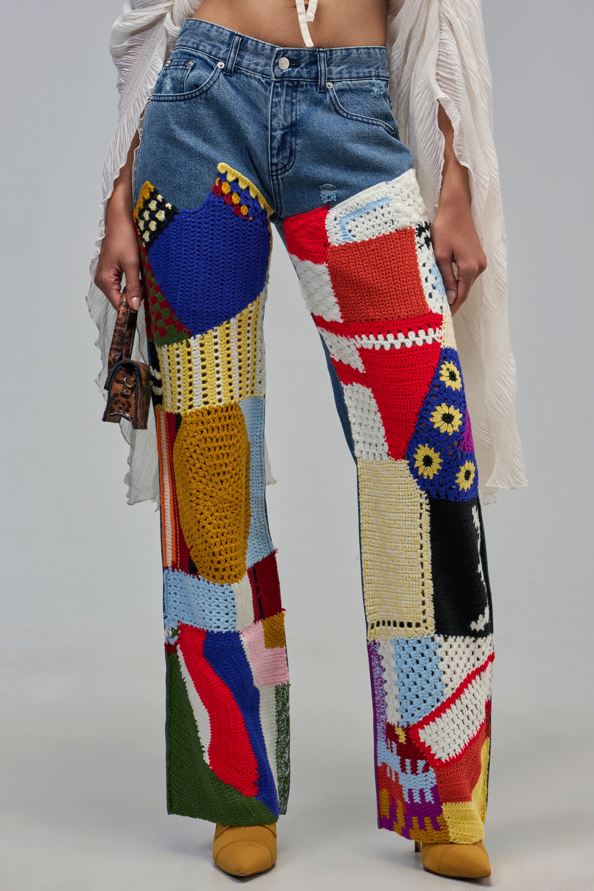 TRYING SOMETHING DIFFERENT CROCHET RELAXED DENIM: relaxed-fit wide-leg jeans in blue denim featuring a multi-colored, patchwork crochet design.