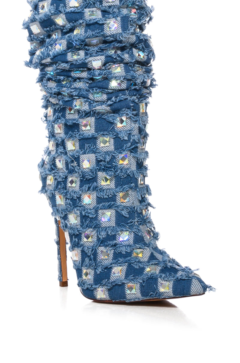 The AZALEA WANG EVE Denim Knee-High Embellished Boot features a single stiletto heel covered in textured blue fabric with frayed edges and adorned with grid-patterned reflective rhinestones for a shimmering effect. 9