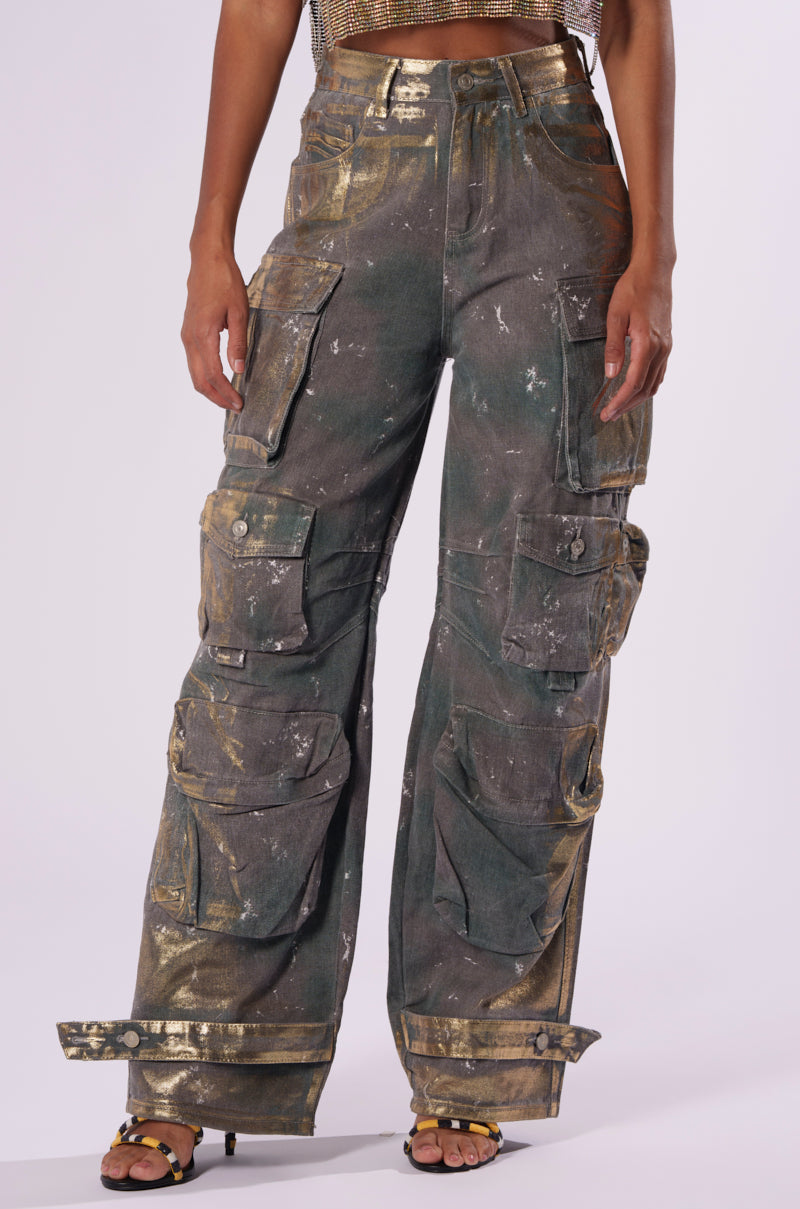 Person wearing the WAITING TIL NEXT YEAR METALLIC DENIM PANT paired with yellow sandals.