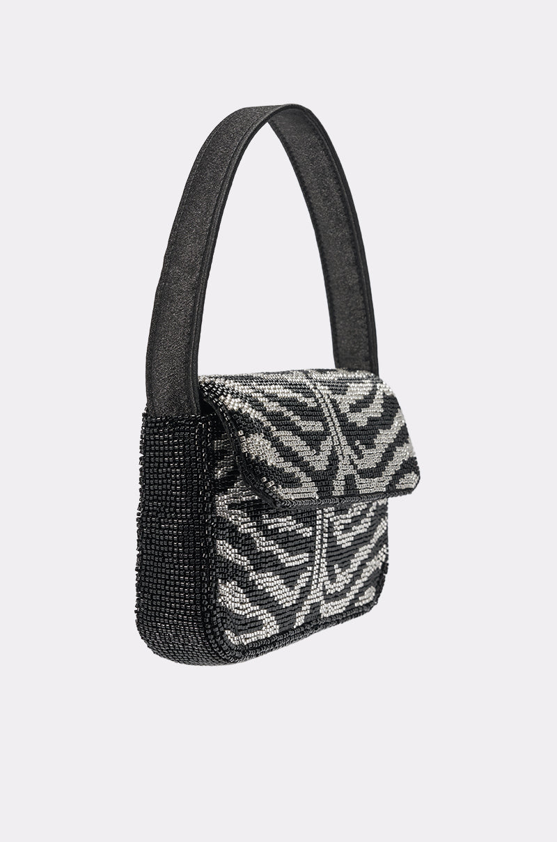 The VIVIANNE BEADED PURSE is a small evening shoulder bag featuring black and silver zebra stripes in beads, a black handle, flap closure, and is shown on a light gray background—perfect as an eye-catching clutch for any occasion. 4