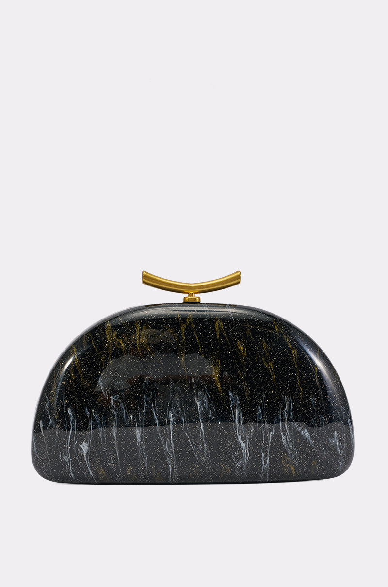The ABSTRACT ART CLUTCH features a semi-circular black acrylic design adorned with striking gold streaks, delicate white veins, and is finished with a gold clasp on top. Set against a plain light gray background, this evening handbag makes the perfect statement accessory for any sophisticated occasion.