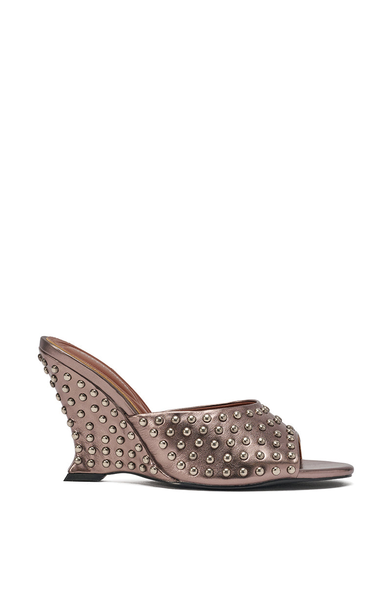 The AZALEA WANG FABRON PEWTER EMBELLISHED WEDGE SANDAL features metallic faux leather, a wedge heel, open toe and heel, and two wide straps embellished with round silver studs for a bold look. 4