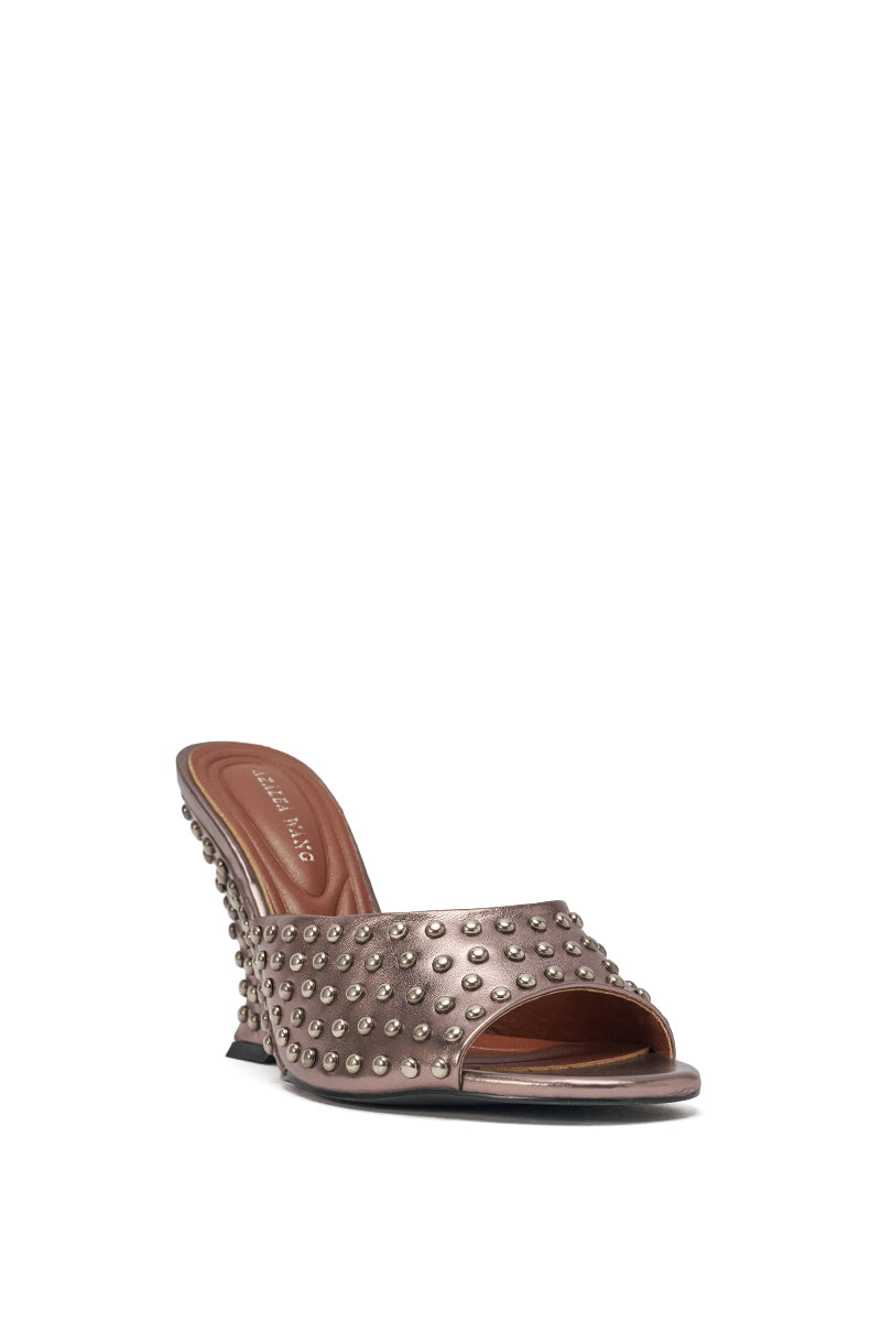 The AZALEA WANG FABRON PEWTER EMBELLISHED WEDGE SANDAL is a metallic faux leather wedge with an open toe and back, featuring multiple rows of silver studs on the upper and heel for a chic, modern look. 5