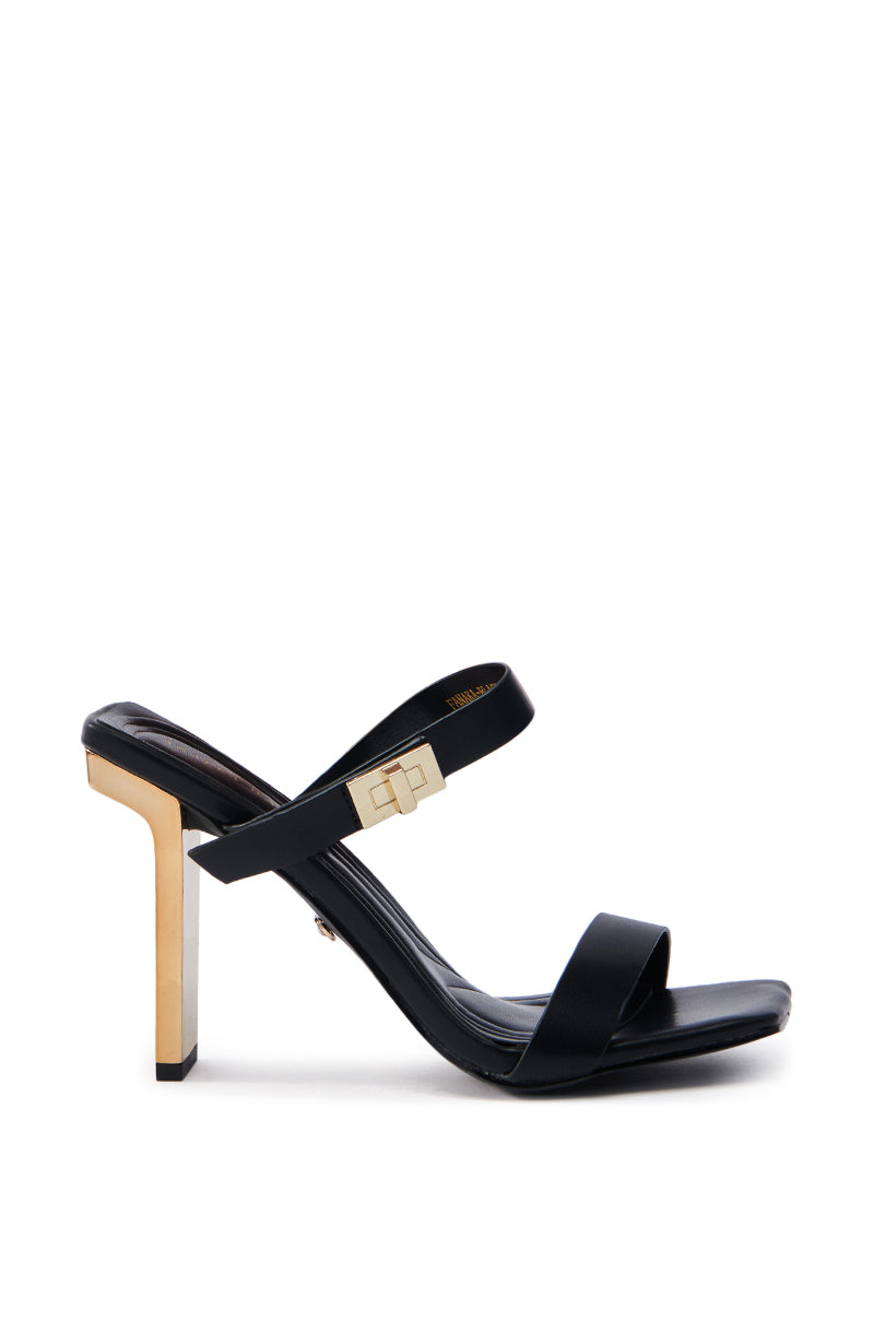 The AZALEA WANG FANAKA BLACK CHUNKY SANDAL is a chic, modern shoe with an open square toe and two sleek straps—one adorned with a gold buckle. It features a geometric gold heel that contrasts elegantly with the faux leather, ideal for a fashionable look.