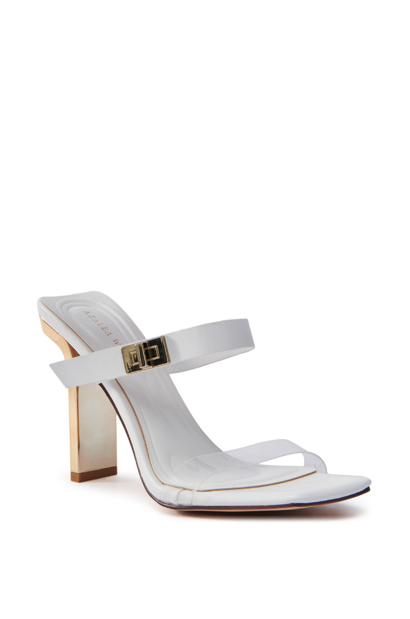 The AZALEA WANG FANAKA WHITE CHUNKY SANDAL is a stylish vegan leather high-heel with an open square toe and dual thin straps, one with a gold buckle. It features a medium-height heel accented in gold and a sleek, minimalist sole for elegance.