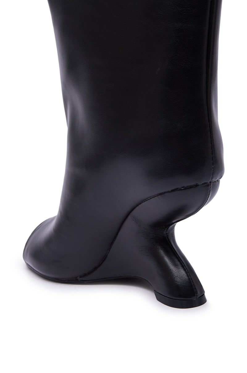 Close-up of the AZALEA WANG FAOI Black Inverted Wedge Open-Toe Bootie heel, featuring a sculptural, curved design and smooth finish, displayed against a white background.