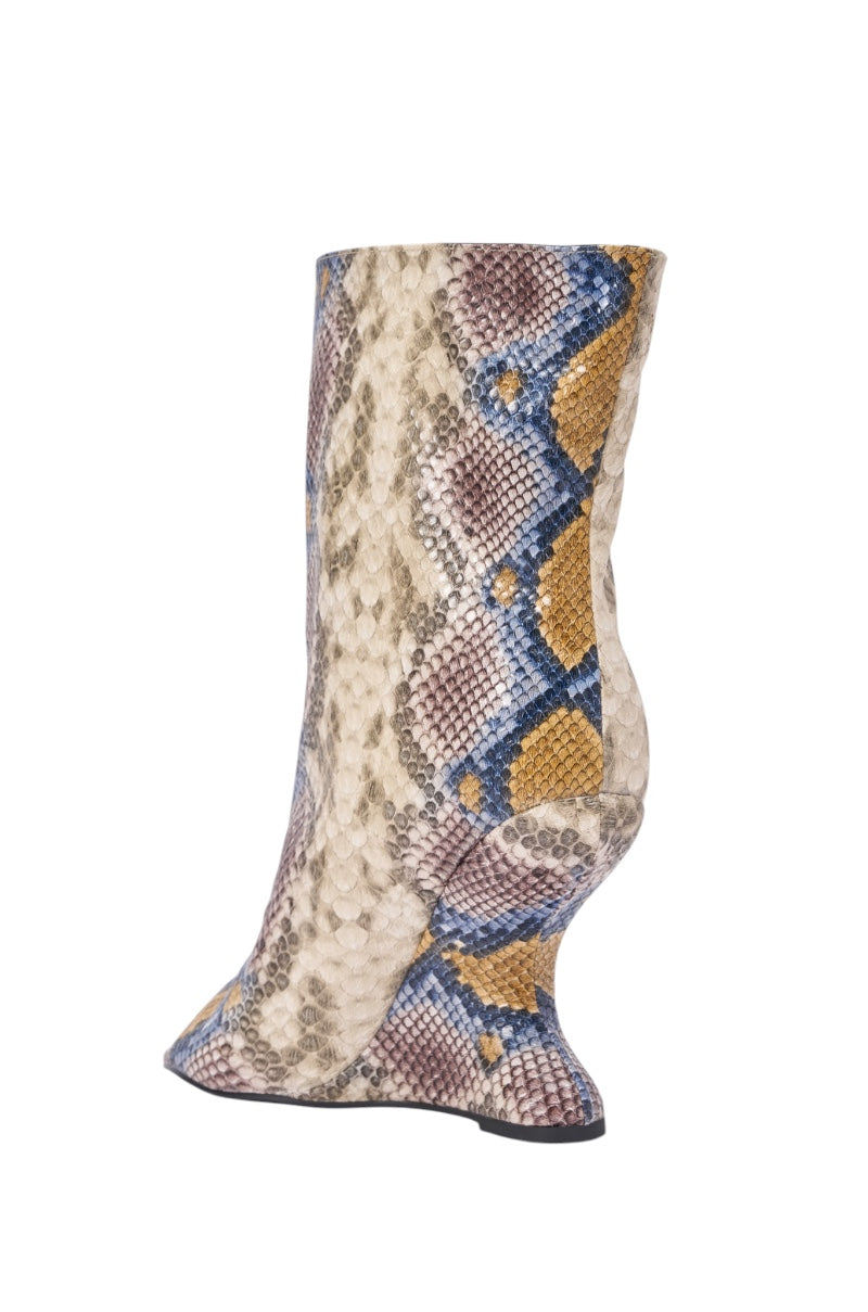 The AZALEA WANG FAOI SNAKE MULTI OPEN TOE WEDGE BOOTIE features an inverted wedge heel, a wavy silhouette, and multicolored snake print in beige, brown, blue, and yellow on crisp white faux leather. 5