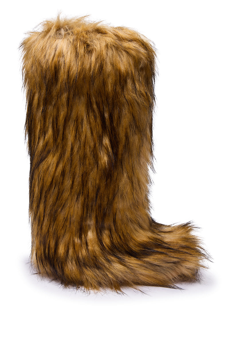 The AZALEA WANG FAYES BROWN MULTI FURRY KNEE HIGH FLAT BOOT, covered in long brown and black faux fur resembling animal fur, stands upright on a white background.