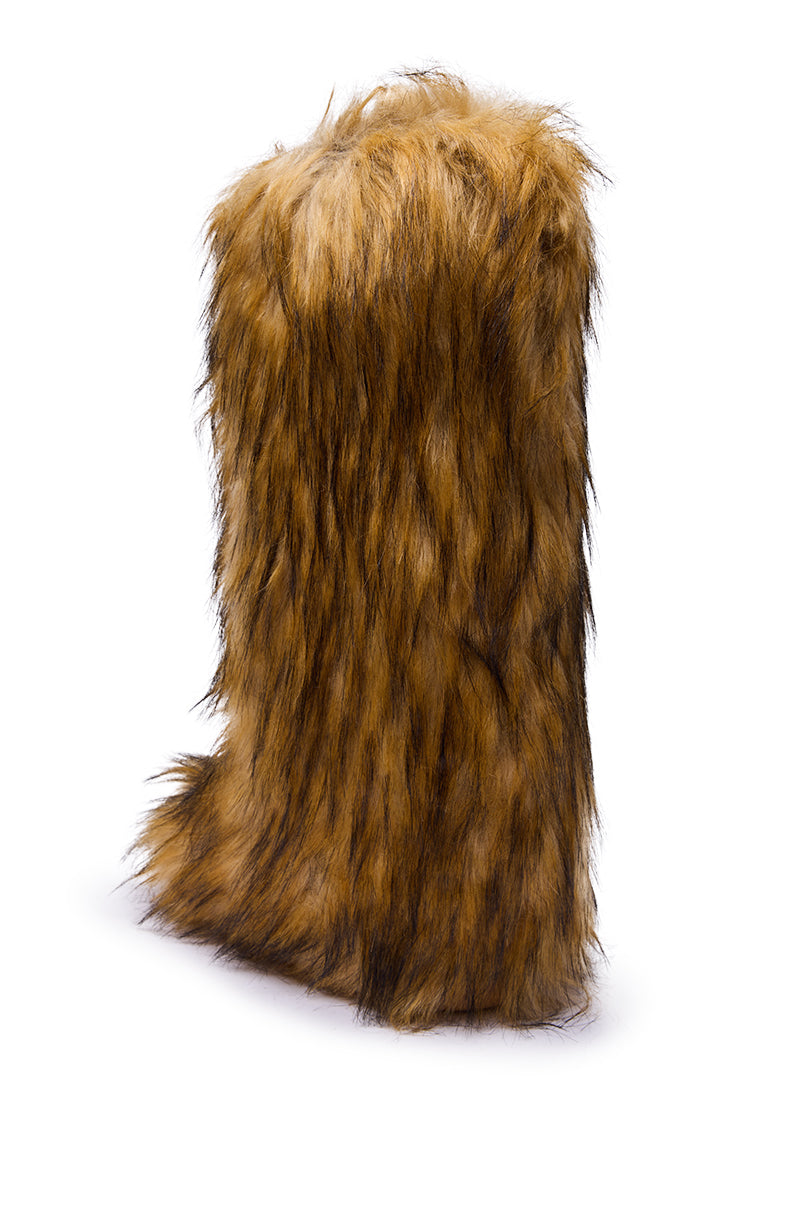 The AZALEA WANG FAYES BROWN MULTI FURRY KNEE HIGH FLAT BOOT, covered in long brown and black faux fur, stands upright on a white background.