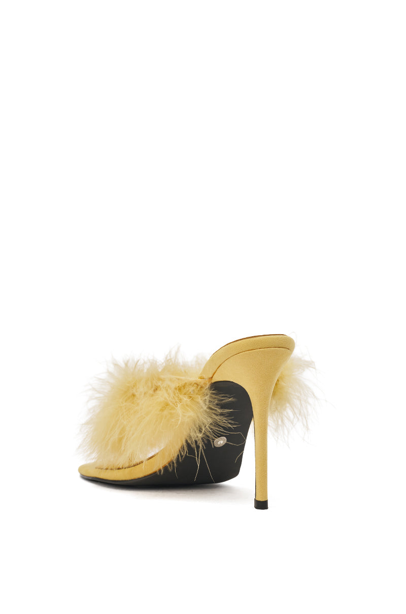 The AKIRA FEMINISTA Yellow Faux Suede Sandal features a kitten heel, pale yellow fur embellishment, open toe, comfort cushion insole, and a chic, stylish look. 5