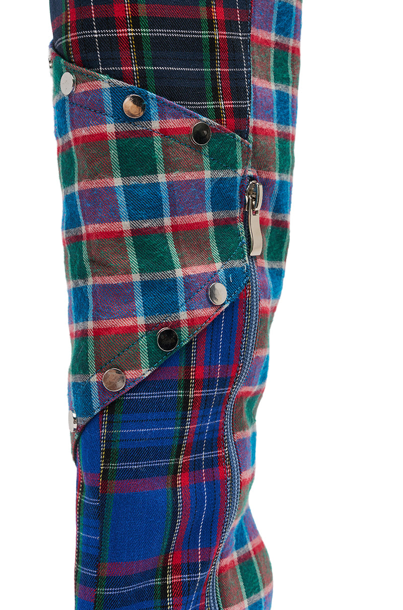 The AZALEA WANG FENMORE PLAID MULTI COLOR BLOCKED STILETTO BOOT is a knee-high statement boot crafted from colorful plaid fabrics, with metal snaps and a visible side zipper. 6