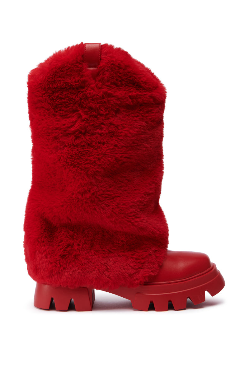 The AZALEA WANG FIESTY RED FUR BOOTIE showcases a chunky red design with a thick, faux fur upper and a striking treaded platform sole. This faux leather bootie features a smooth toe and a handy pull loop at the top, offering both style and practicality.