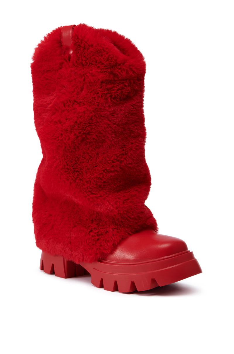 The AZALEA WANG FIESTY RED FUR BOOTIE is a vibrant red boot featuring a chunky block heel and a textured, fuzzy exterior. Made from faux leather, it boasts deep treads on the sole for optimal grip. This boot seamlessly combines warmth and style, embodying the charm of a fashionable faux fur bootie while offering functional appeal.