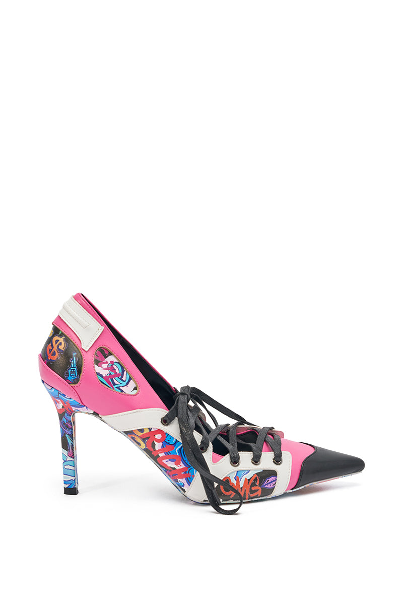 The AKIRA GOLD FIRST STRING GRAFFITI PUMP is a pointed-toe stiletto with vibrant pink, black, and white panels, colorful graffiti designs, black laces, and a slim lace-up silhouette. 5