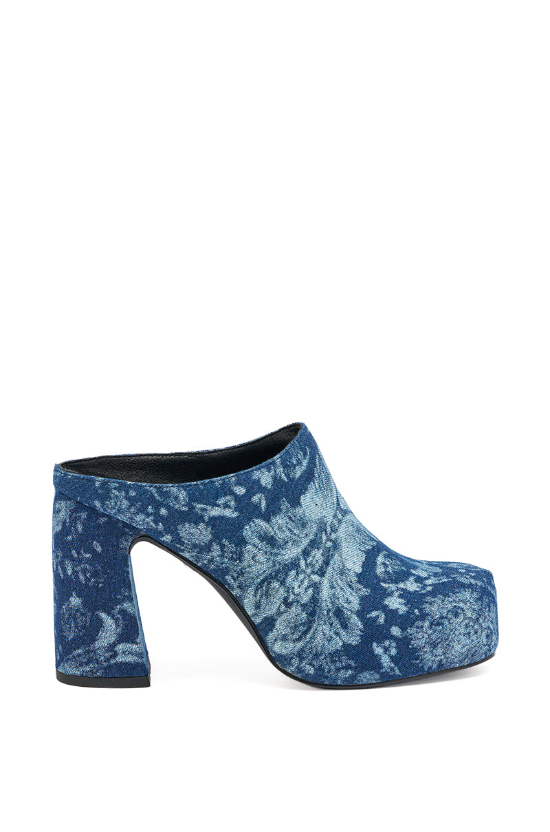 The AZALEA WANG FLOREA DENIM PRINT MULE is a blue denim slip-on mule with a chunky high heel, closed square toe, and floral pattern. 4