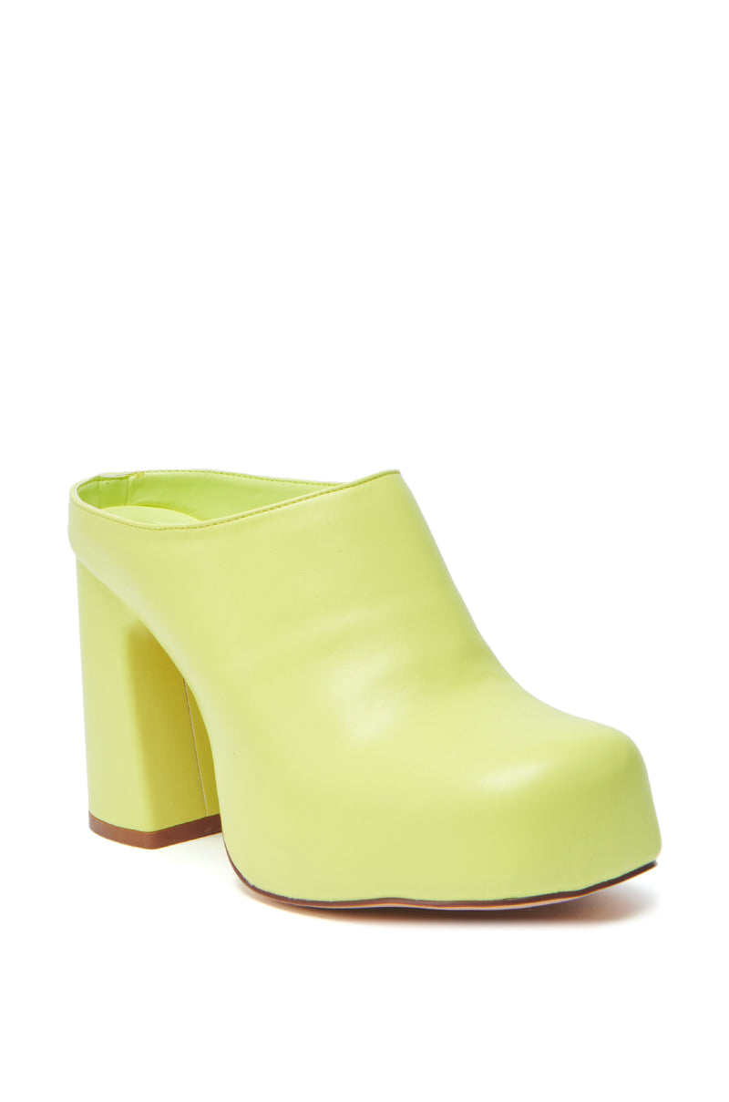 The AZALEA WANG FLOREA LIME CLOG STYLE PUMP is a lime green faux leather mule with a closed toe and chunky high block heel, presented against a plain white background.