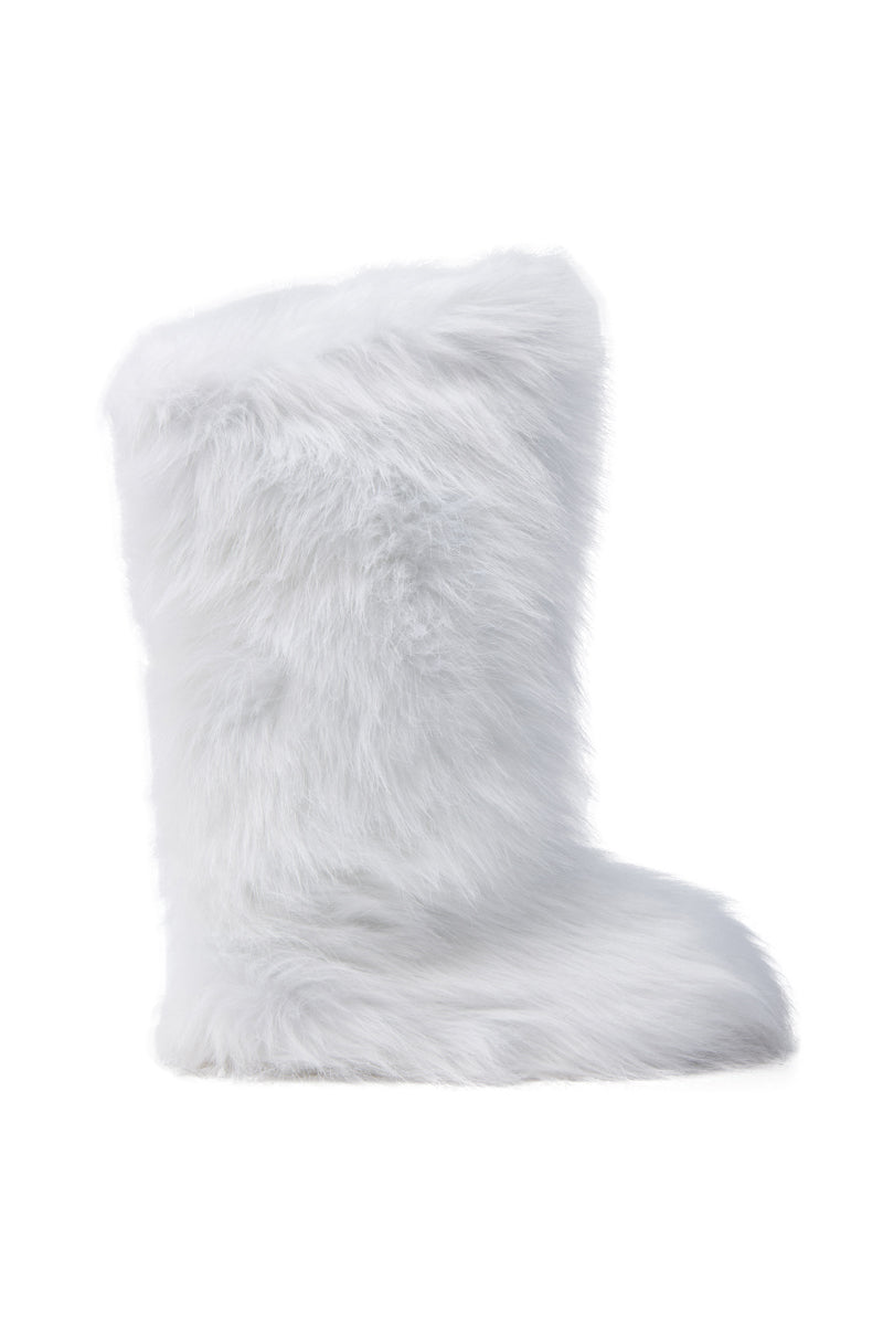 The FONDA WHITE FLAT BOOT features an all-over faux fur texture, a knee-high shaft, and a flat sole, displayed against a plain white background.