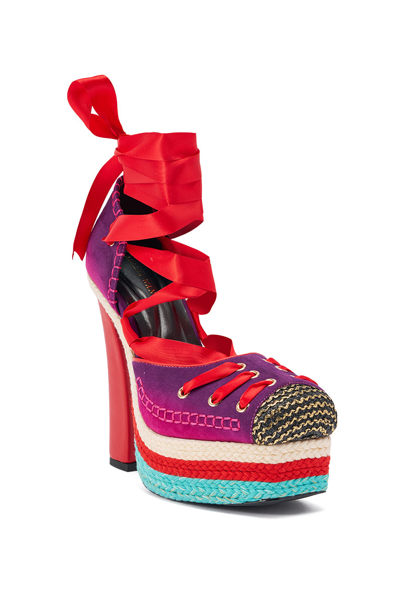 The AKIRA GOLD FONTEYN RED MULTI CHUNKY PLATFORM LACE UP PUMP is a retro-glam suede heel with red trim, turquoise-beige woven platform, black-gold toe cap, and red ribbon ankle laces. 4